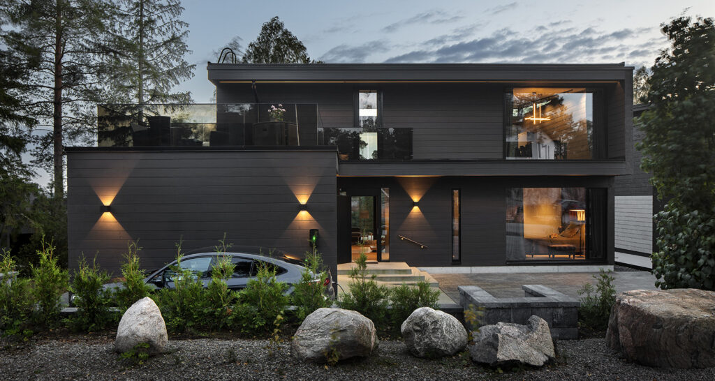 Modern black Polar Life Haus log home.